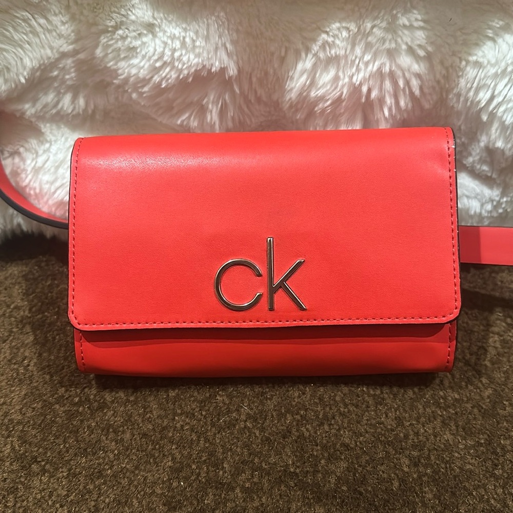 NWoT.  Calvin Klein red leather belt bag.